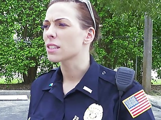 Female cops jam up black suspect and suck his cock