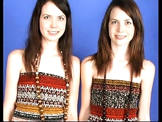 Identical lesbian twins posing draw up and similar to one another all...